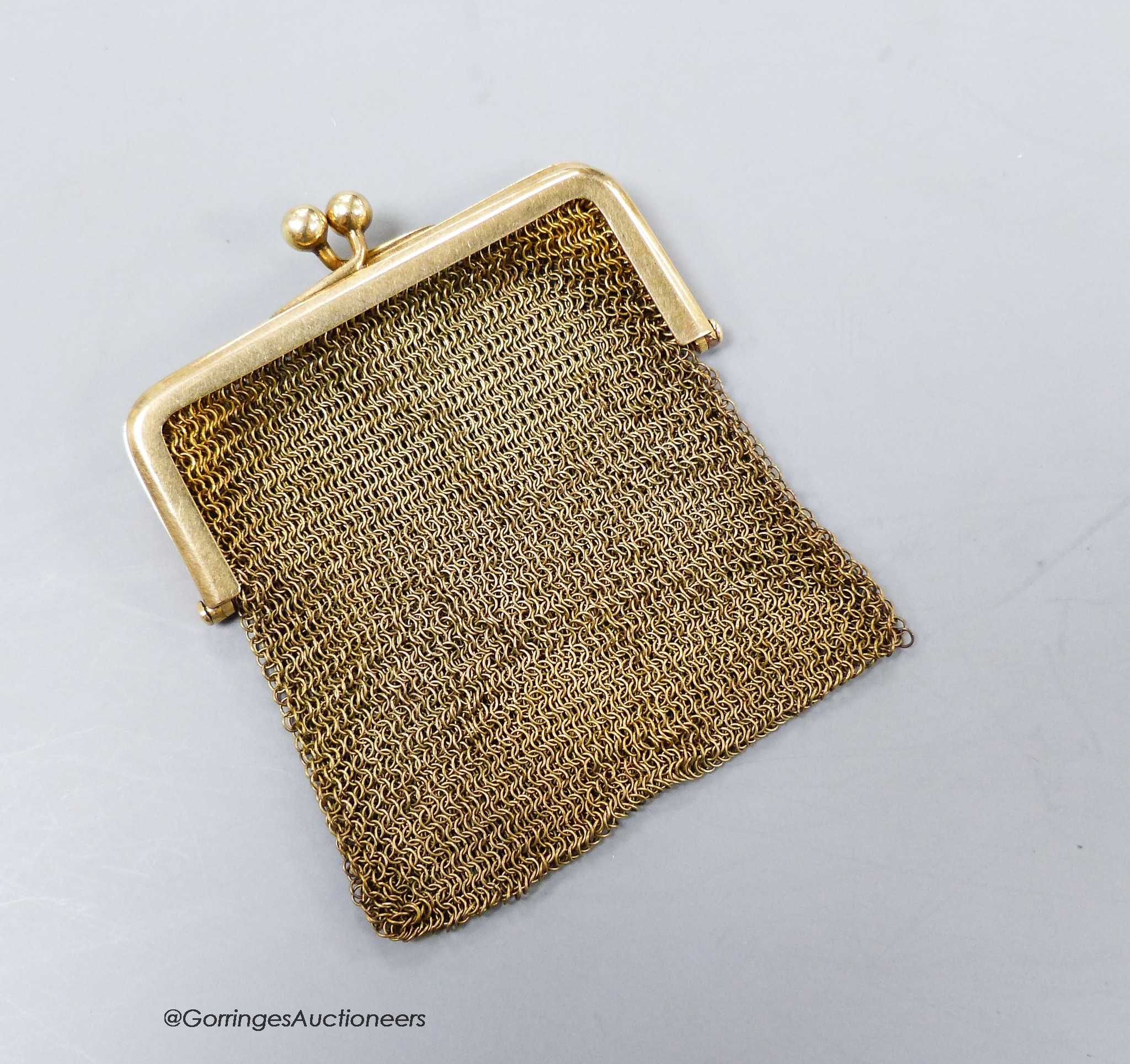 A small yellow metal (stamped 9ct) mesh evening purse, gross 33.5 grams.